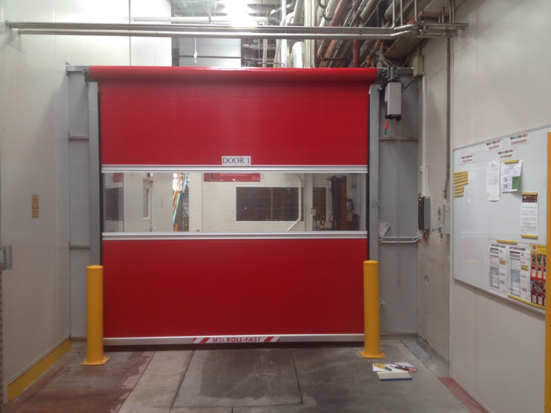 Rapid Roll Maintenance technicians installing a high-speed industrial door in Victoria